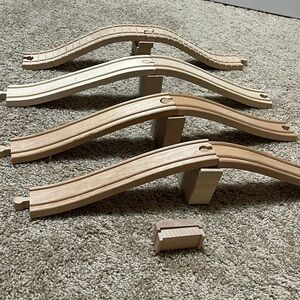 Ramp pieces for wooden train tracks. One set is Thomas & Friends brand.